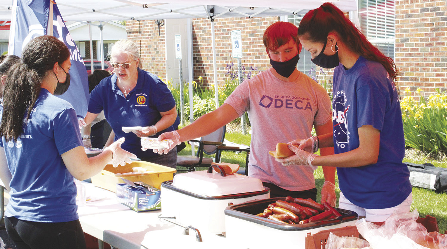 Sun Prairie DECA students help Optimist fundraiser for Explore Children's Museum
